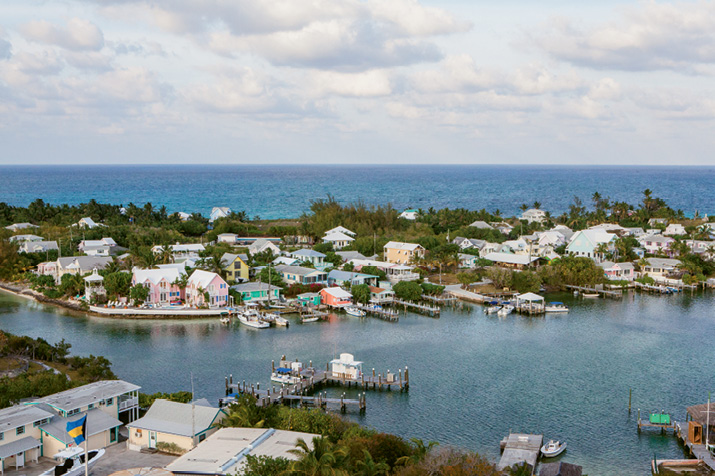 A view of Hope Town Harbour from the top of the lighthouse and the main road through town