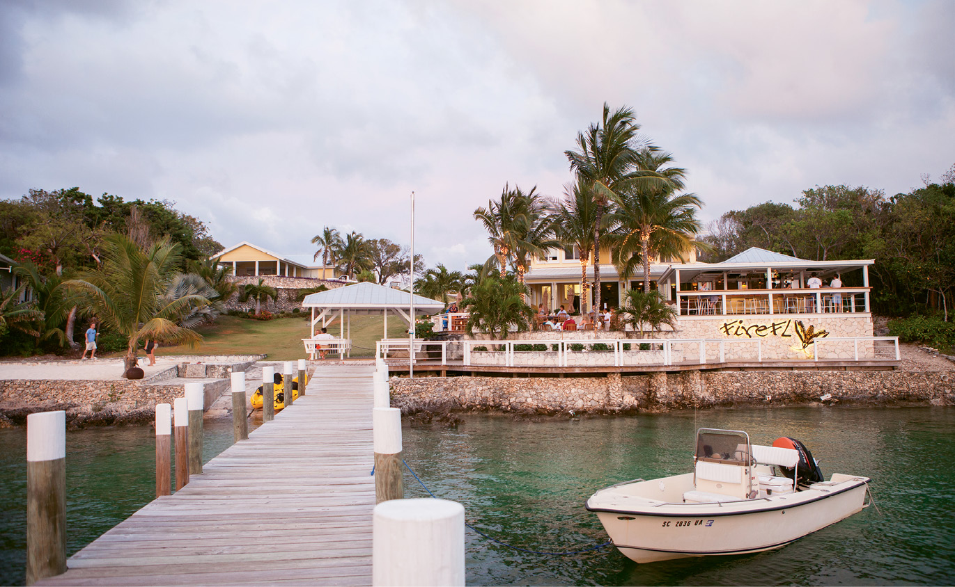 Diners and drinkers arrive to Firefly Sunset Resort by both golf cart and boat