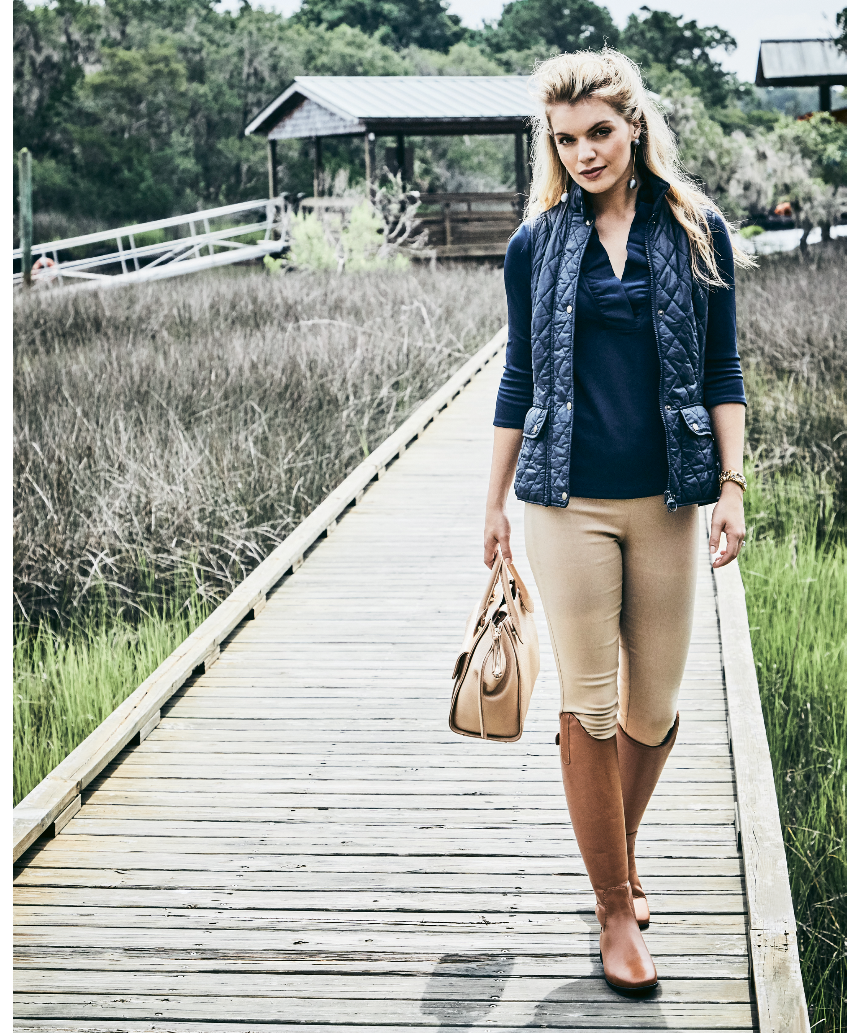 Vest Dressed - Gretchen Scott jersey “Ruffneck” top in “navy,” $99, and Gretchen Scott spandex pant, $109, both at Gretchen Scott; Barbour “Otterburn Gilet” vest in “navy,” $129 at M. Dumas &amp; Sons; Modern silver ball drop earrings, $38 at Tara Grinna Swimwear; estate 14K gold, sapphire, and pearl bracelet, $8,500 at Croghan’s Jewel Box; Sommer “Athen” tall leather boots, $300 at Bits &amp; Pieces.