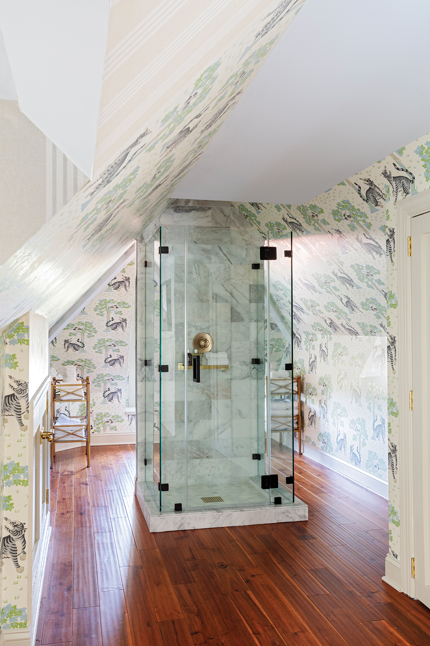 Thibaut wallpaper in animal prints (in the adjacent bath, right) keeps the mood fun.
