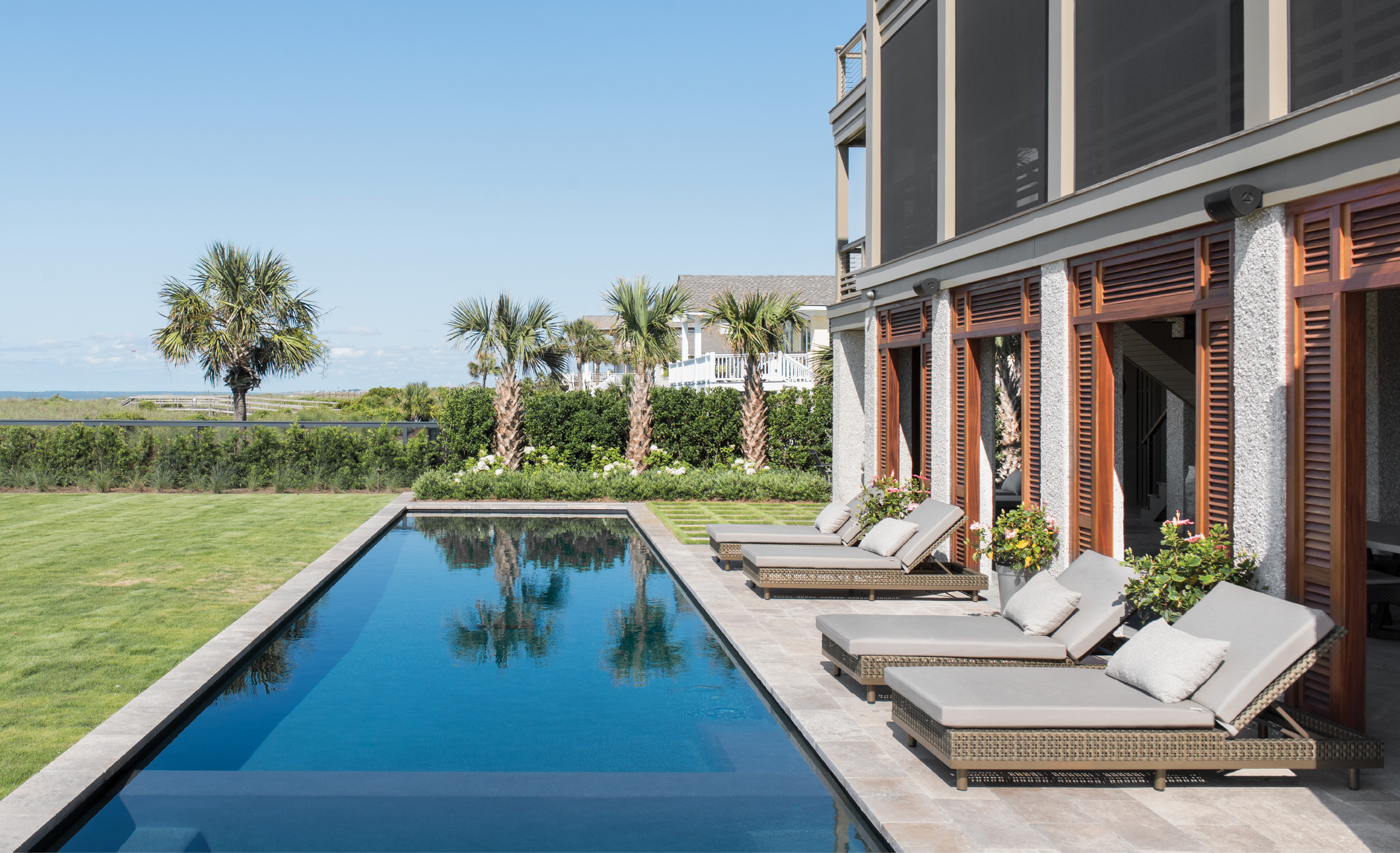 Castaway: Clad in traditional tabby, a “coastal concrete” made of oyster shell, this Isle of Palms stunner sits on a large, slightly elevated lot. Ample outdoor spaces take full advantage of the spectacular views.