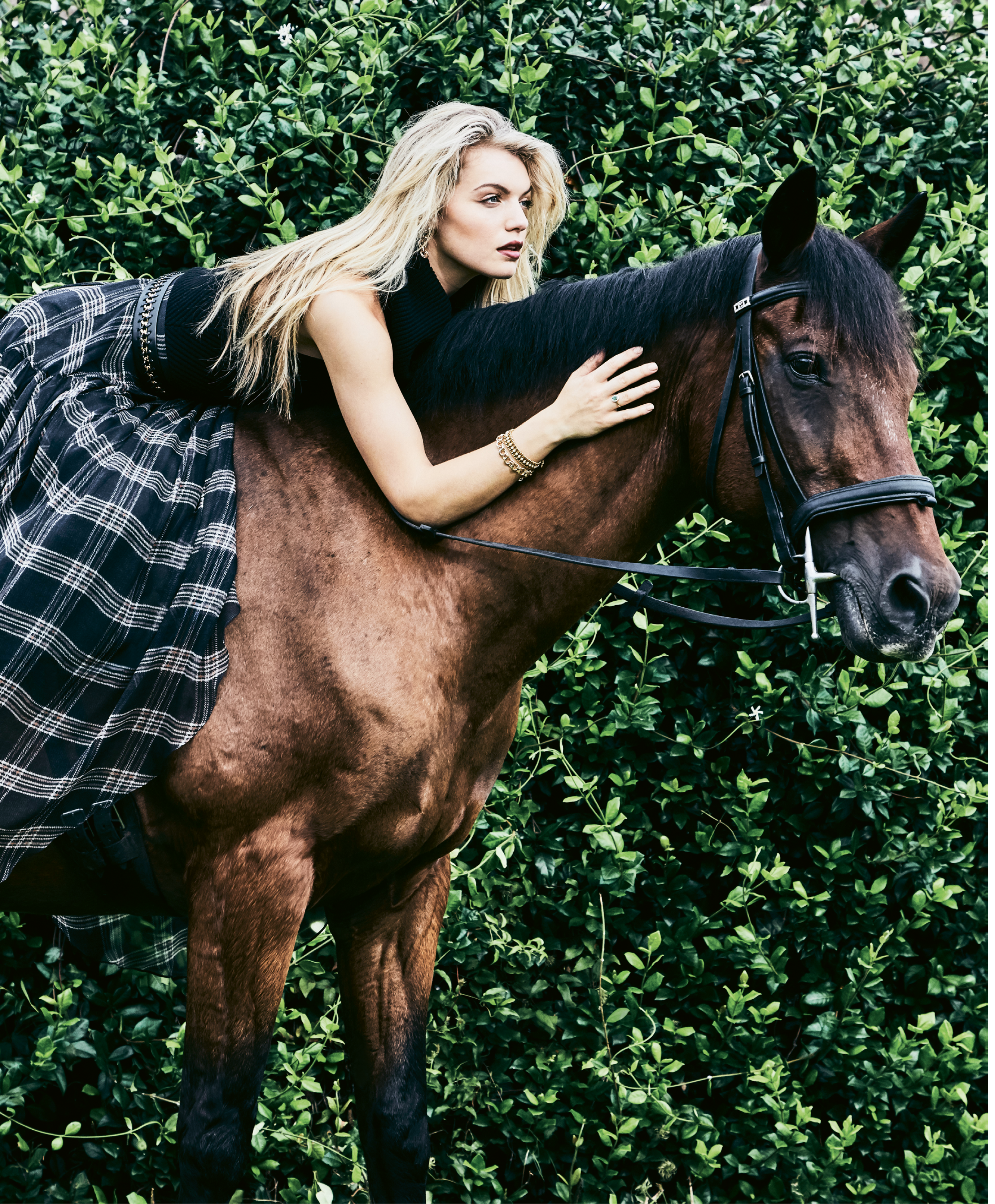 Mane Event - Alice &amp; Olivia “Darcey” wool funnel-neck sweater, $275 at Gwynn’s of Mount Pleasant; Brunello Cucinelli silk chiffon maxi skirt, price upon request at RTW; Suzi Roher leather and chain belt, $385 at Gwynn’s of Mount Pleasant; Firenze Jewelry earrings, $69 at The Hidden Countship; estate gold and pearl bracelet, $4,550 at Croghan’s Jewel Box; 14K gold charm bracelet, $3,979 at Sandler’s Diamonds &amp; Time; 18K gold, emerald, and diamond ring, $2,000 at Gold Creations.  Pictured on Blarney (owned by Dr. Katie Loewenstine, D.V.M.)