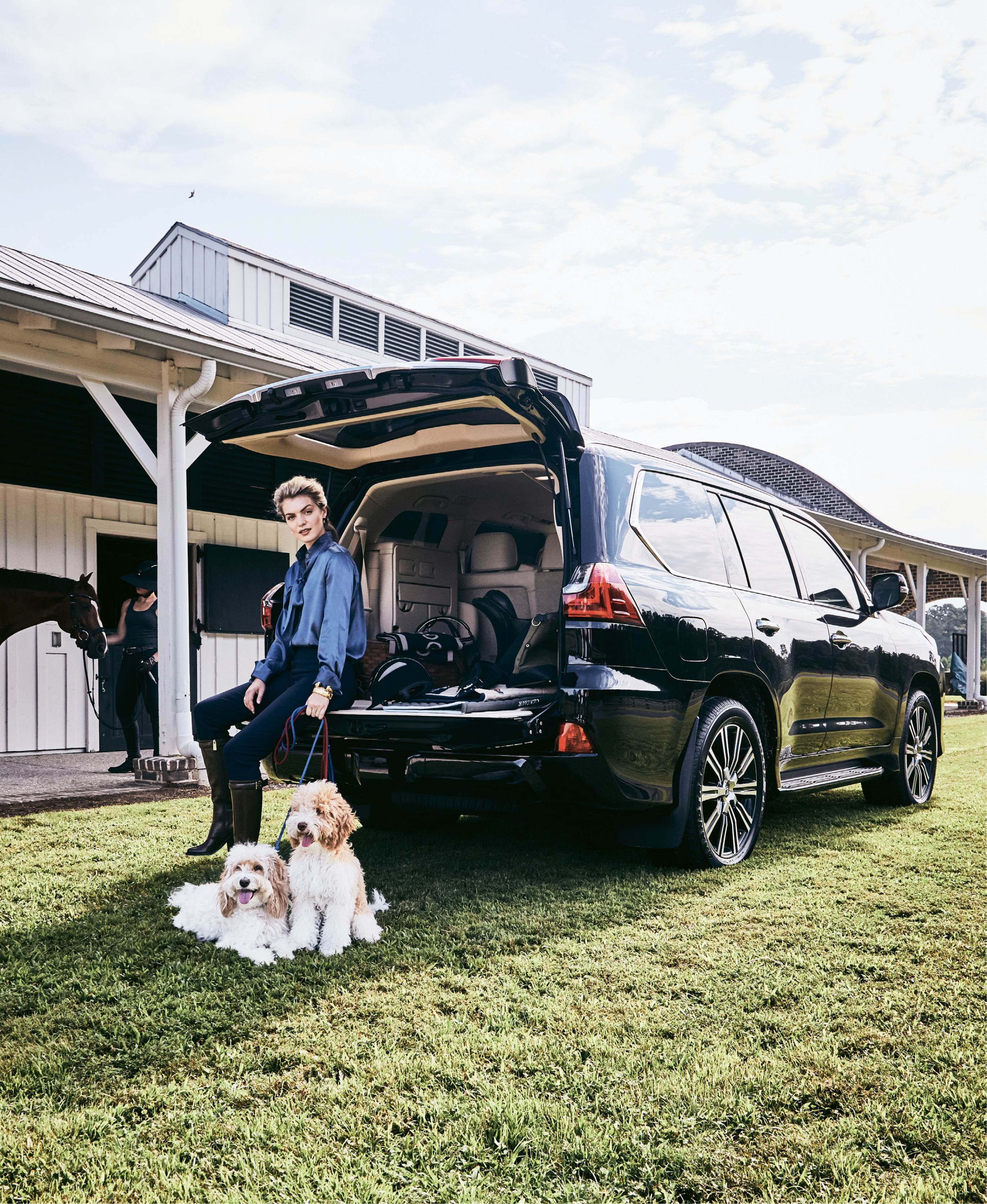 Pony Up - 0039 Italy “Odella” silk blouse, $258 at Out of Hand; Krazy Larry ankle pant in “navy,” $118 at Lori + Lulu; Chloé leather knee boot, price upon request at RTW; 18K gold and diamond drop earrings, $2,940 at Croghan’s Jewel Box; Julie Vos 24K gold-plate “Byzantine” hinge cuff with iridescent sapphire blue and mother of pearl, $245, and 24K gold-plate “Catalina” cuff, $245, both at Gwynn’s of Mount Pleasant; One K “Defender” helmet, $260, at Bits &amp; Pieces.  The 2018 Lexus LX 570 courtesy of Hendrick Lexus Charleston  Pictured with pups Sullivan and Folly (owned by Josh and Shelby de Freitas) and Peter Pan (Olivia Johnson)