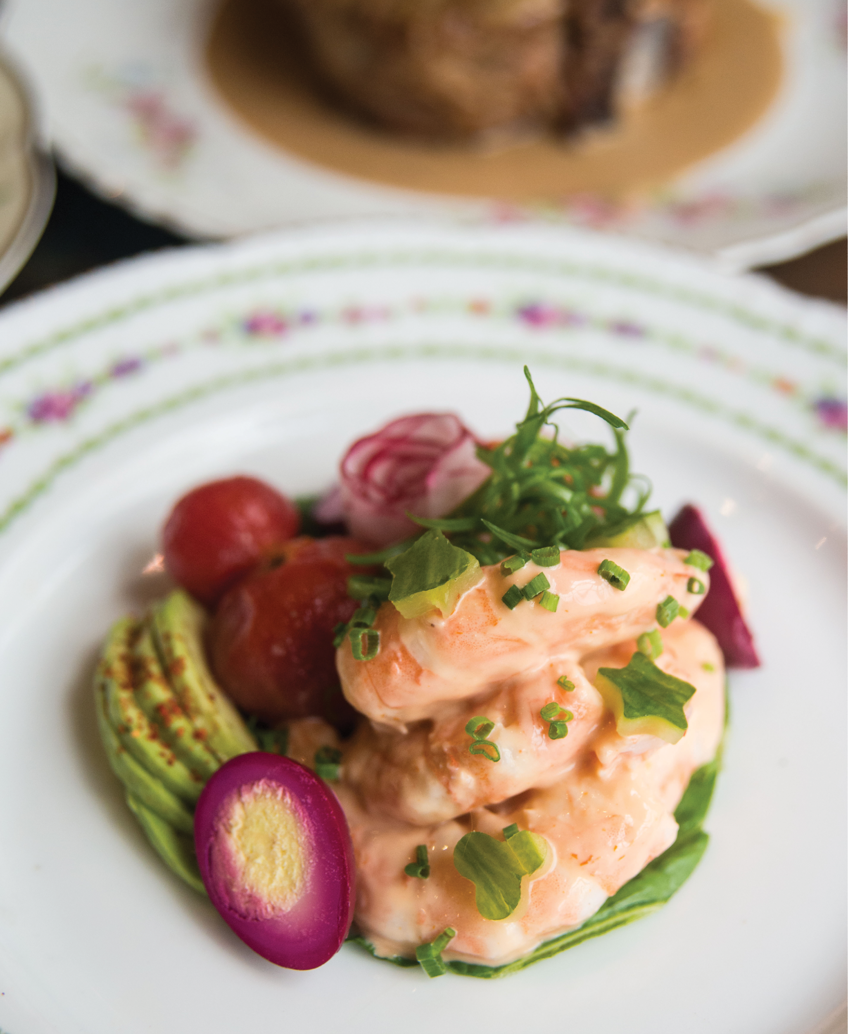A kaleidoscope of flavors and colors characterizes McCrady’s Tavern’s dressed shrimp appetizer, which blends the creamy shellfish with beet-pickled quail egg, Espelette-spiked avocado, au natural tomatoes, and cucumber cutouts.
