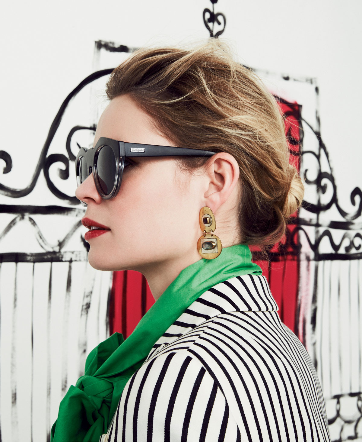 Le Specs “Neo Noir” sunglasses in “matte black clear” with “smoke” lenses, $59 at Hampden Clothing; and Hyla Dewitt “Norell” gold-plated and silver earrings with labradorite and quartz gemstones, $115 at Open Door Shop or hyladewitt.com