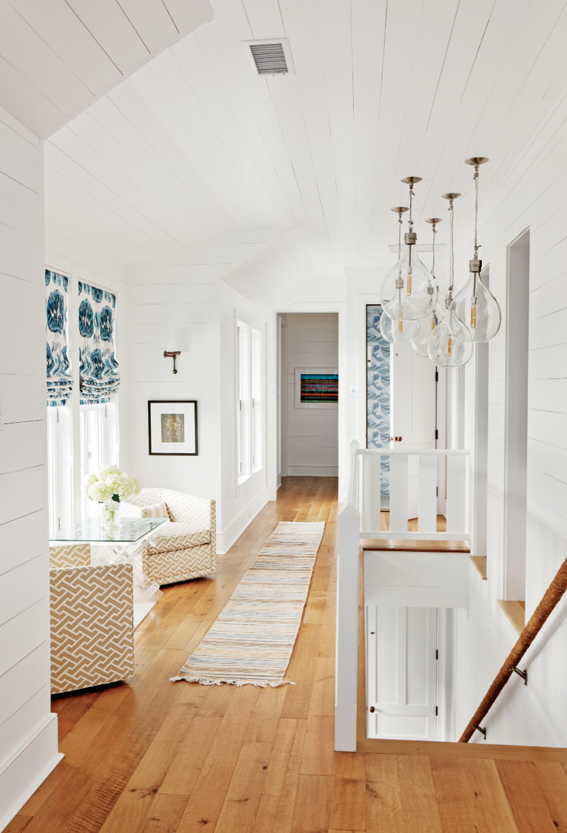 Sunny Spaces: The “hyphen” that connects the street-side wing with the beachfront part of the house also functions as an inviting sitting/reading area.