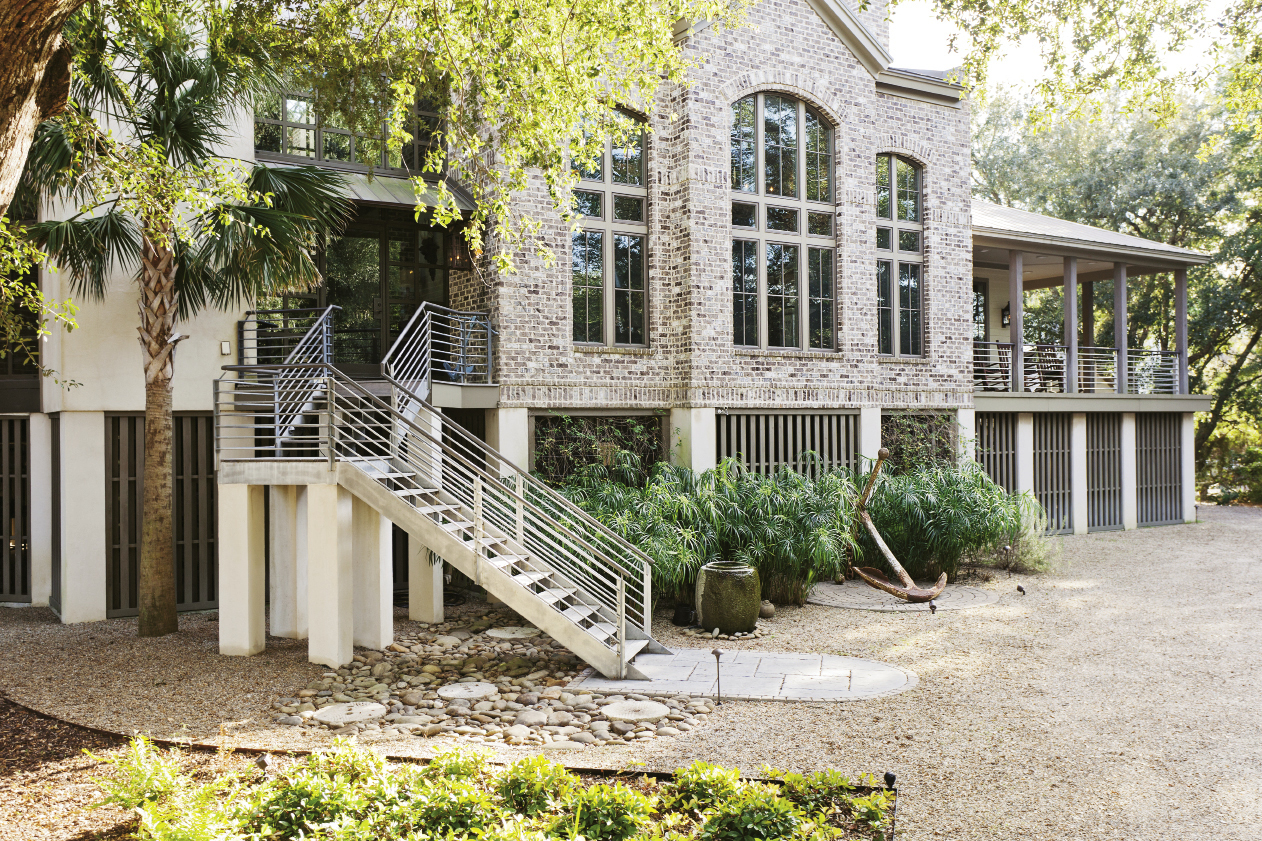 A vintage anchor lends patina to the home’s facade.