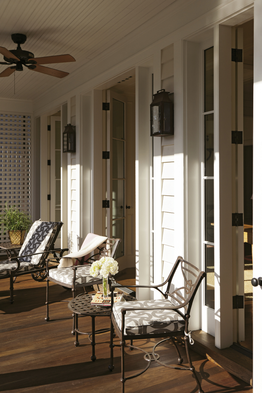 Two porches along the back of the home overlook the personal haven.