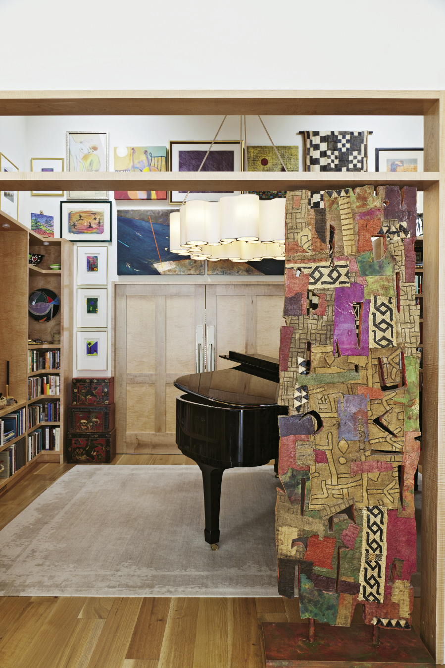 “The challenge was to have as many windows as possible, but also a lot of wall space for her art,” Sanchez says. Many works, including the William Halsey sculpture that fits right into the doorway, found homes in this music room.