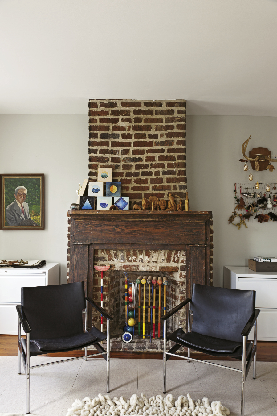 Rice, who studied studio art as an undergrad, conjured the mini geometric paintings on the mantel. The wood carvings were crafted by Nissenboim’s grandfather.