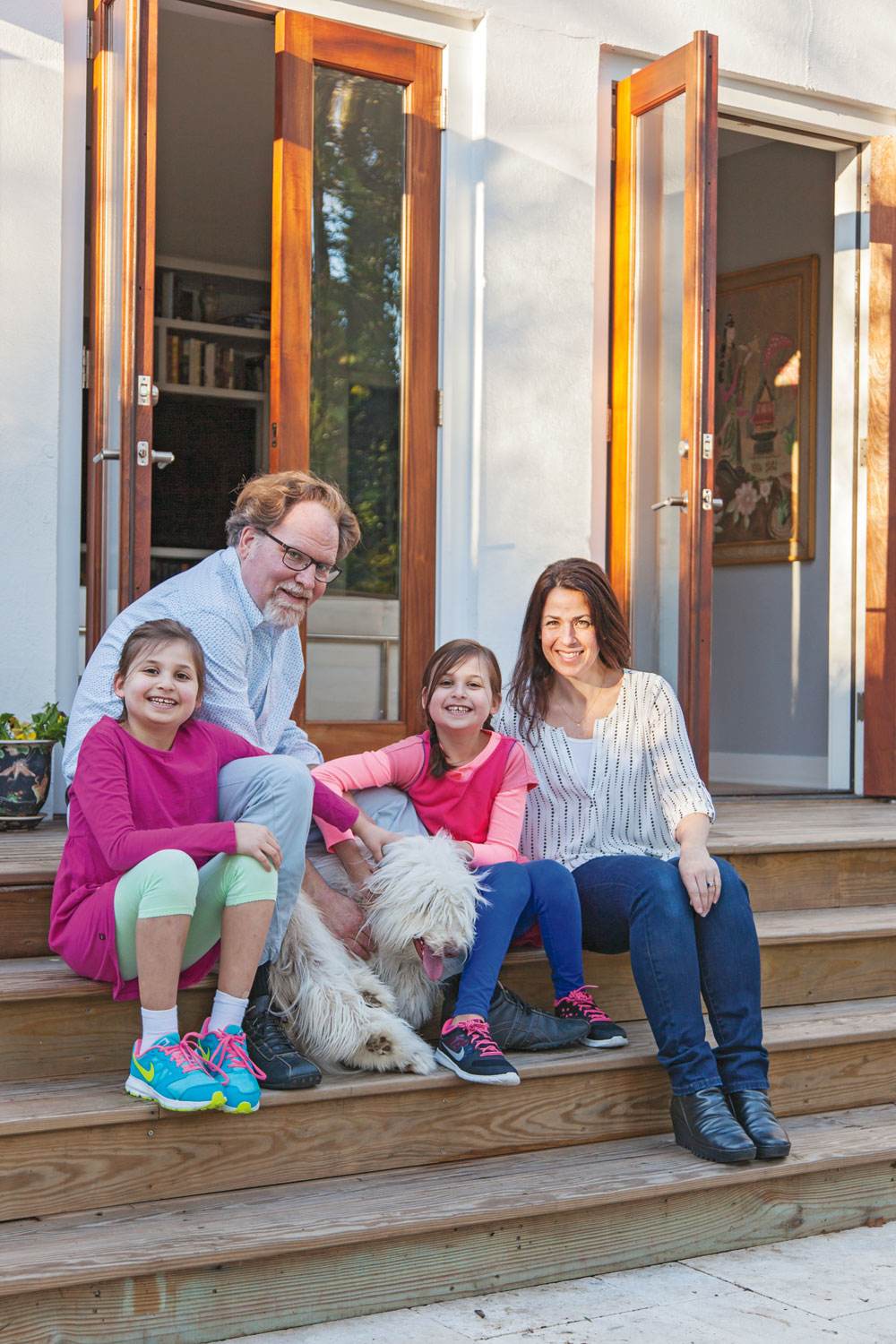 DECKED OUT: An inviting new deck runs the length of the house and draws the family out into the backyard.