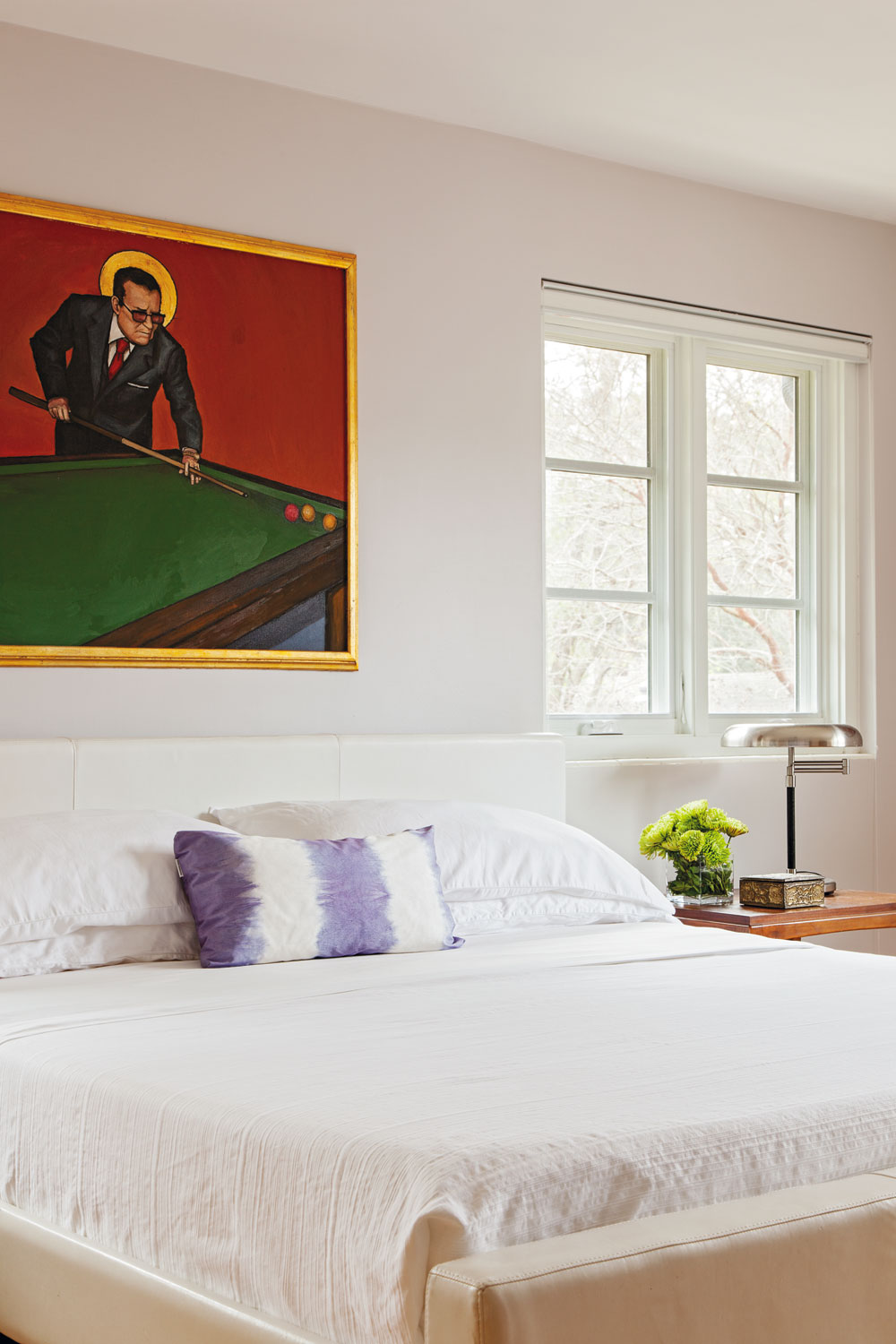 ART WORKS: Christopher is on the board of directors at Redux Studios; his passion for art is reflected in the painting by area artist Bob Snead that hangs in the master bedroom.