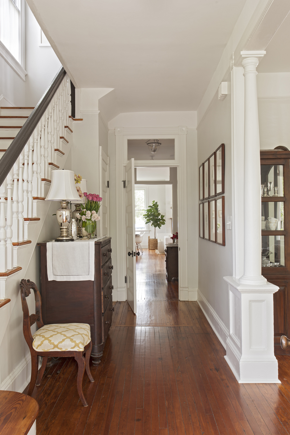 Warm Welcome: In the foyer, guests are greeted by charming original details, such as heart-pine floors and carefully restored millwork.