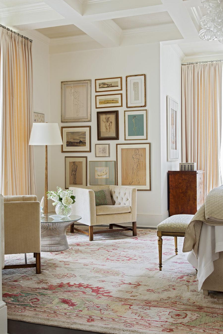 neutral territory: The graceful, first-floor master bedroom is both elegant and modern with ivory drapery and an array of artwork.