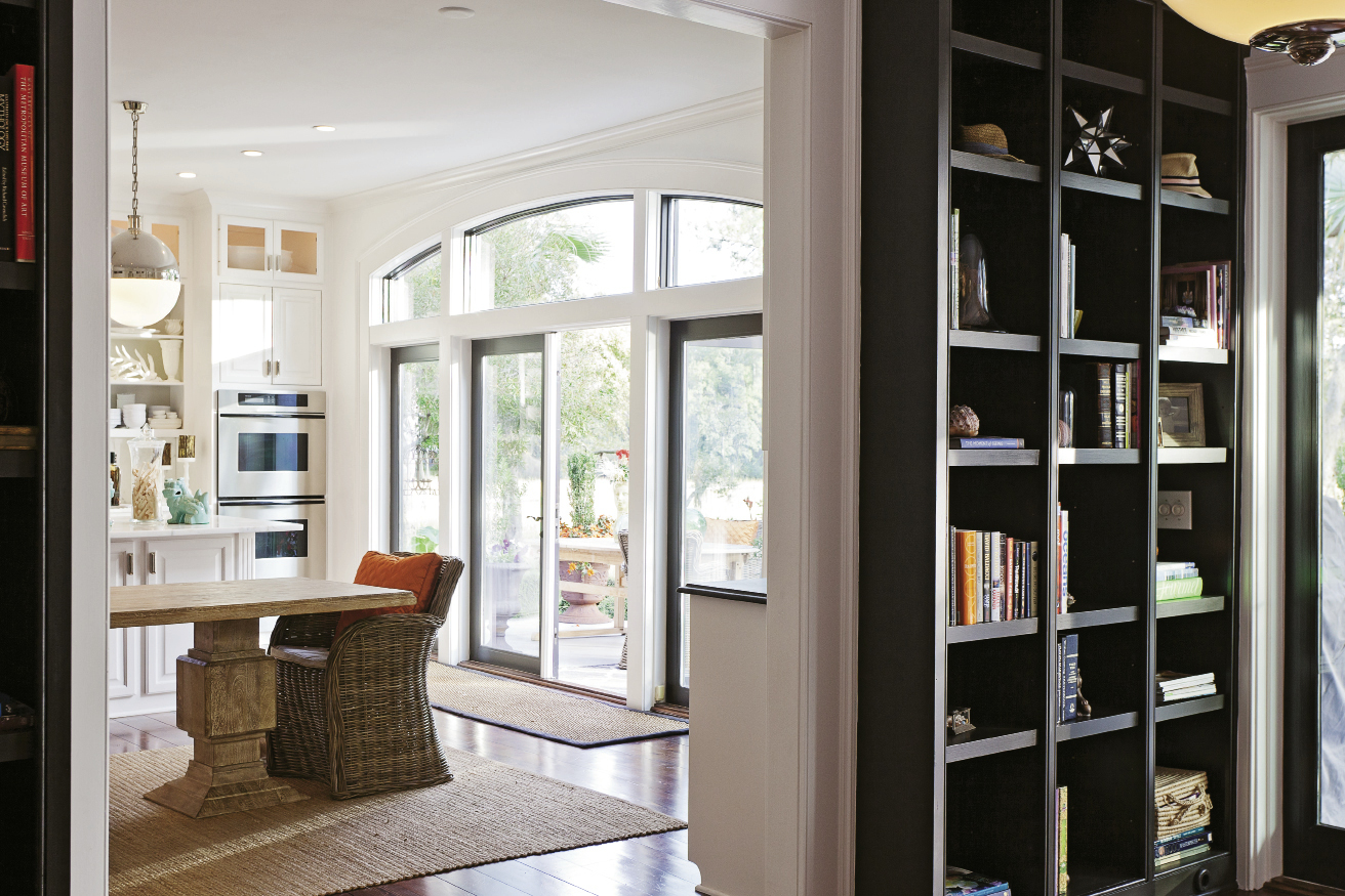 Sunny Chic: Oversize globe pendants from Circa Lighting, polished nickel hardware and lacquered cabinets.