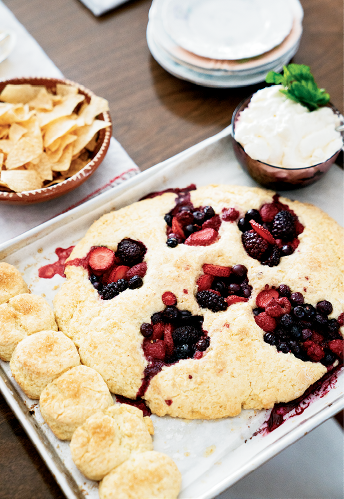 The berry-filled biscuits are served with whipped cream (above), but topping them with vanilla ice cream is also delicious.
