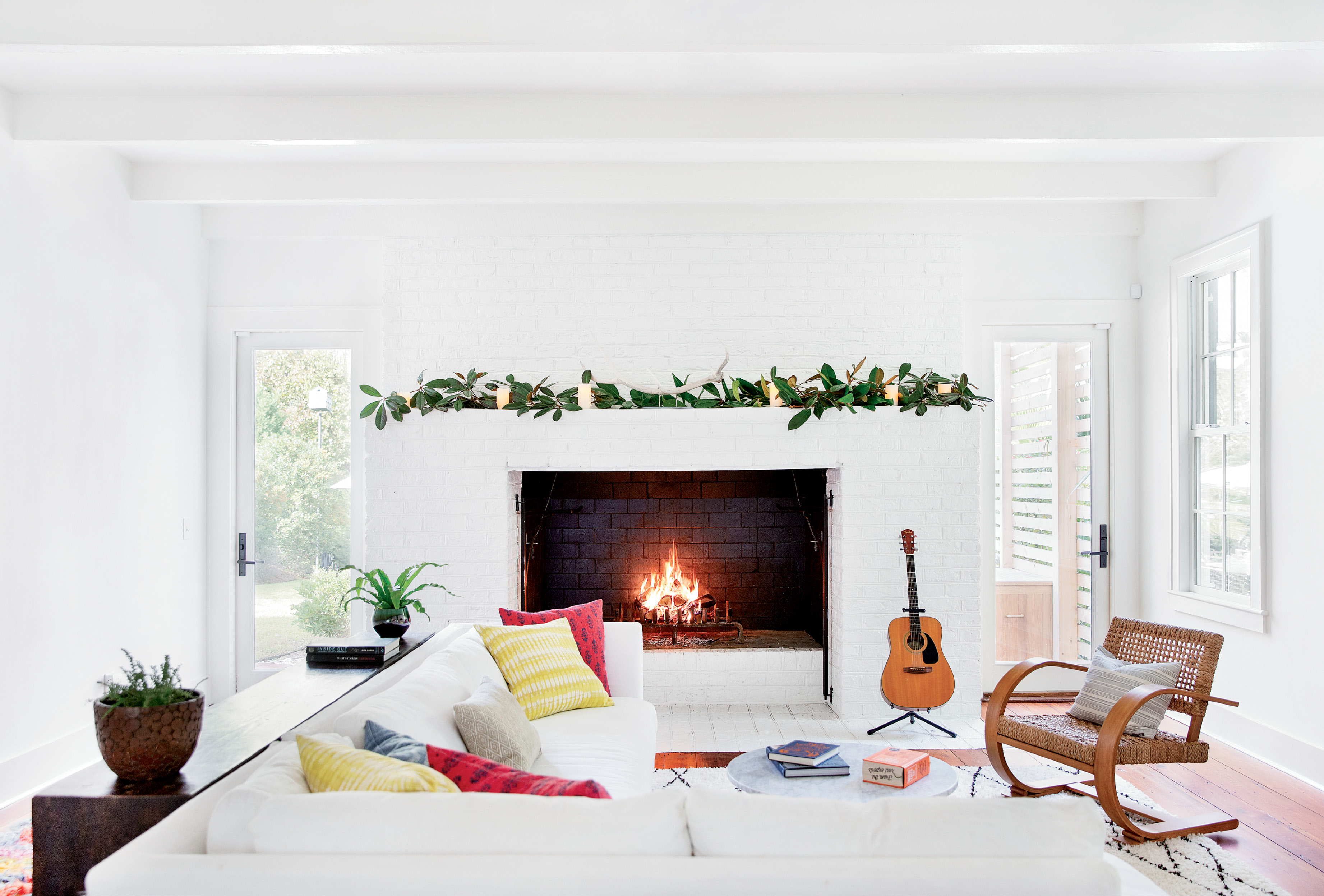 where the hearth is: Thompson redesigned the rear addition, thought to have been built in the 1980s or ’90s, to open the living room—with its massive, inviting fireplace—to the rest of the house.