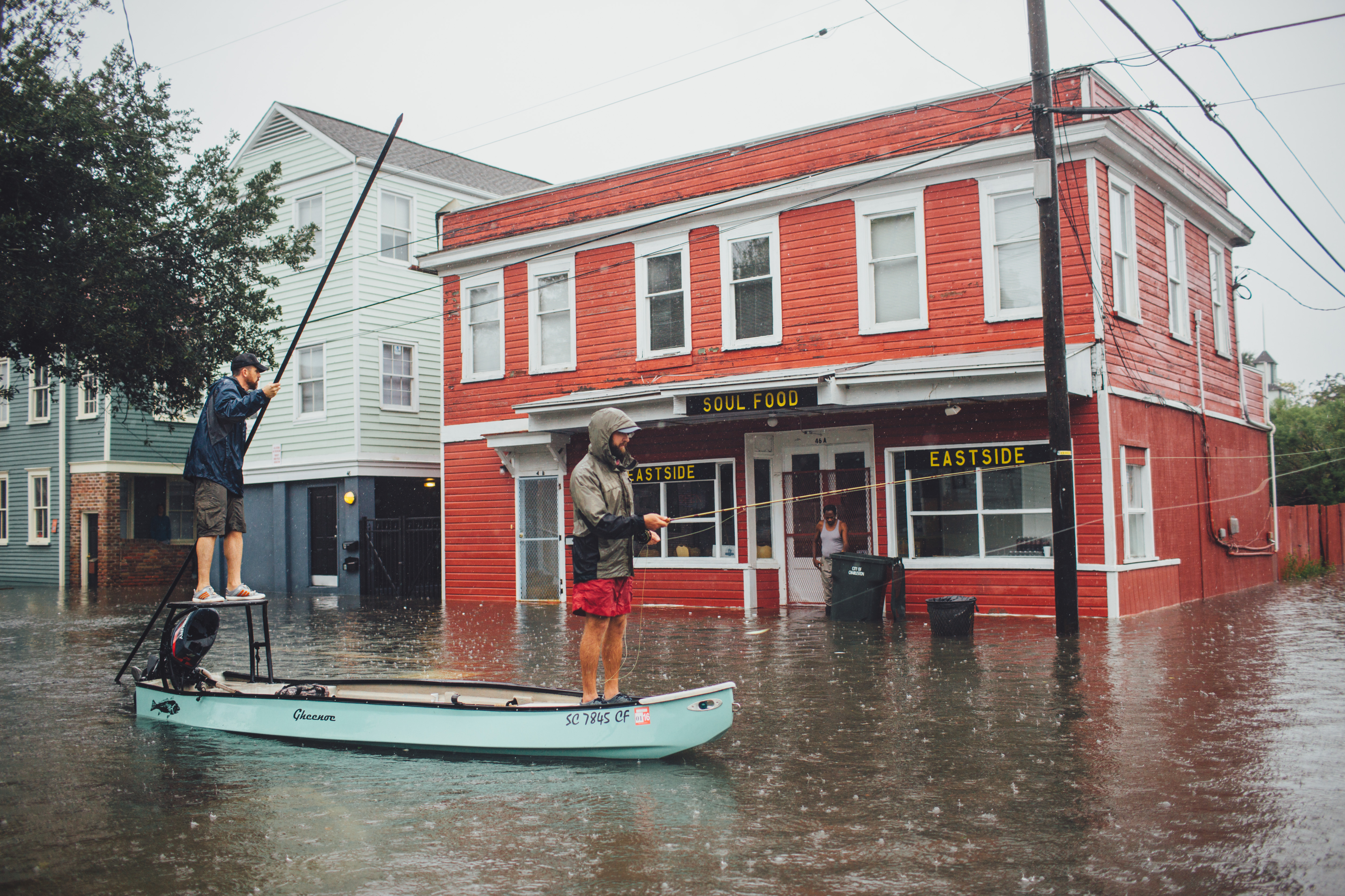 FINALIST Professional category: Charleston Floods by Jeremy Clark; “Trying to make the best of a bad situation, some friends and I take to the flooded downtown streets of Charleston in a flyfishing skiff. Hurricane Joaquin combined with a stalled frontal system to create historic rainfall levels which were exacerbated by offshore winds and higher than normal &quot;spring tides&quot; and a lot of downtown was underwater.”