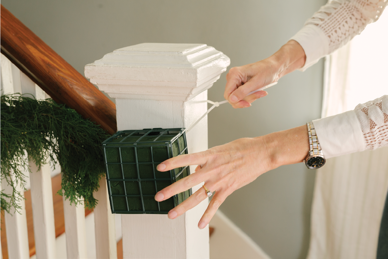 A floral foam cage held with zip ties