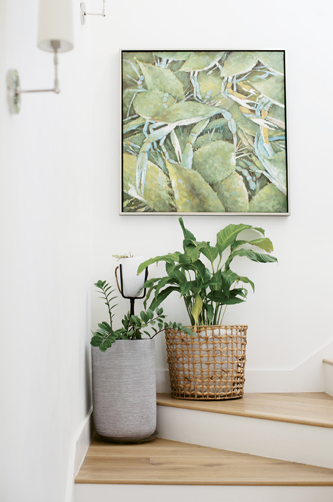 Coastal Living: Hanging in the stairwell to the boys’ rooms, the painting of blue crabs came from their home in Augusta: “I guess we were always aiming for the coast,” Tracie says.