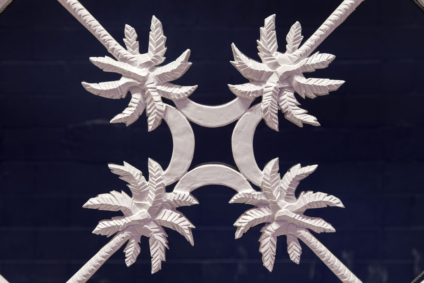 Local iconography was incorporated throughout, including a custom palmetto ironwork lattice fronting a deep indigo background masking the top-tier adjustable acoustical chambers.