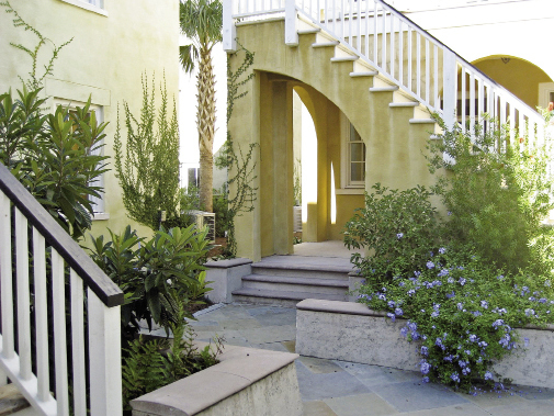 Mixsoning It Up: In this design for North Charleston’s Mixson neighborhood, Lindsey unites multi-family and single-family dwellings with an Old World-inspired stone and formed concrete courtyard that was planned around an existing grand oak.