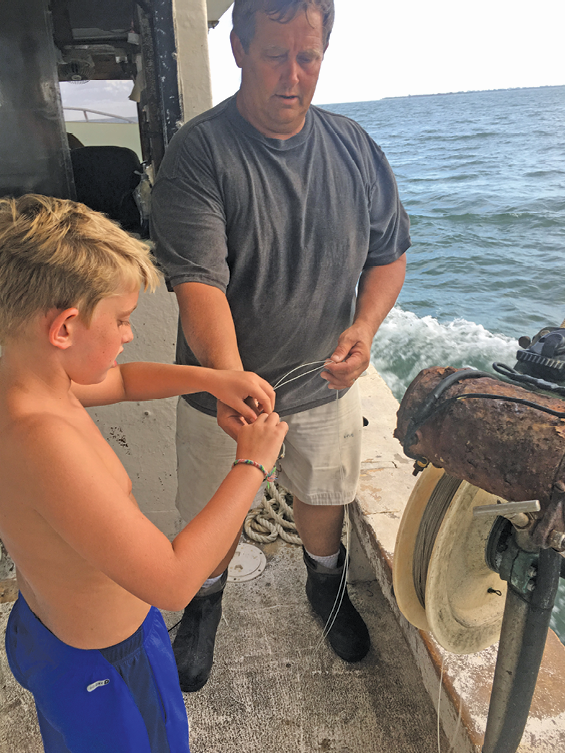 ... and Benjamin, in 2016, join their dad on the Amy Marie when time allows.