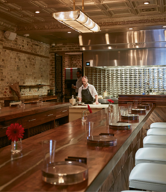 Front-Row Seat: The U-shaped counter provides guests with up-close views of the dinner prep and presentation.