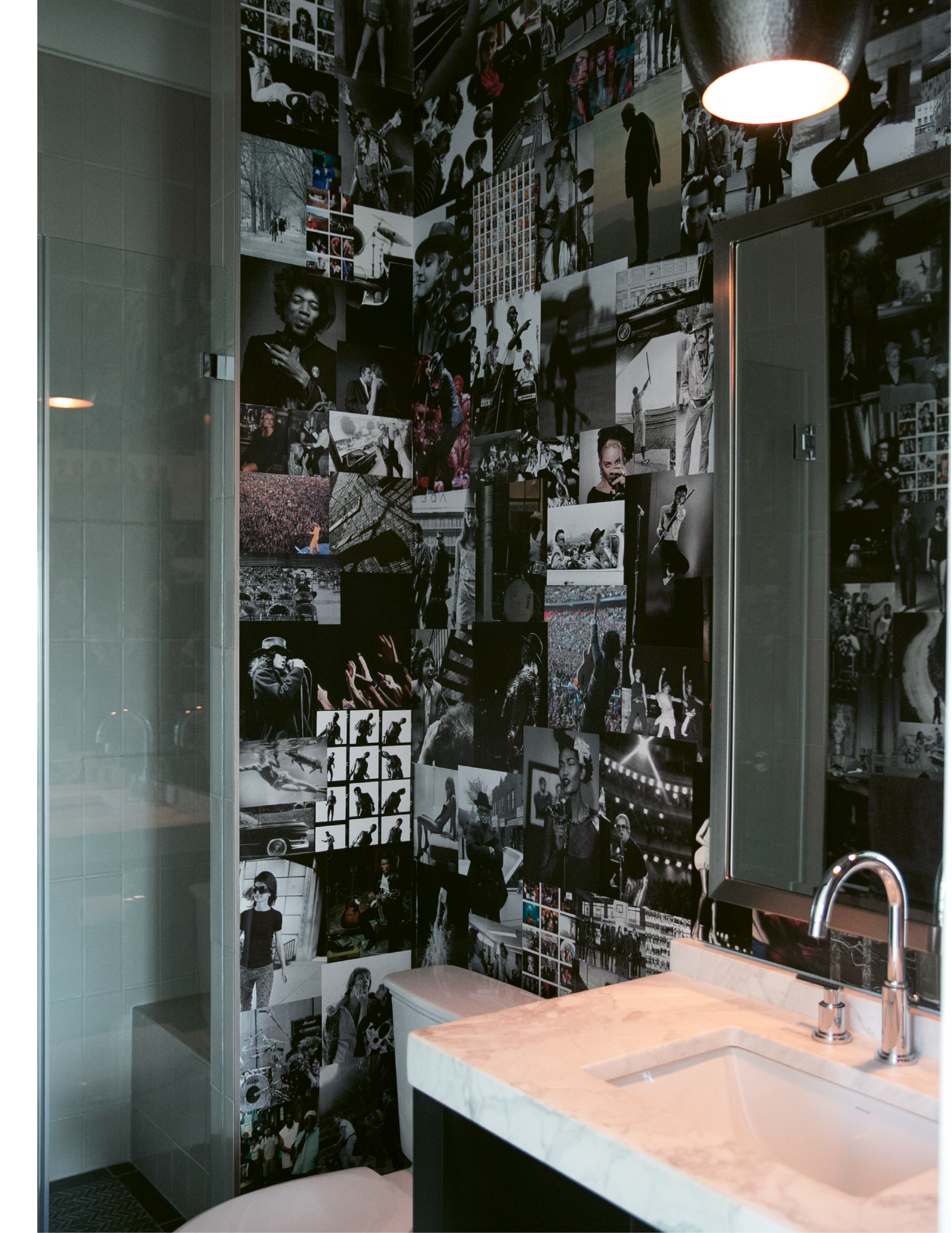 Melissa and Brad made the wallpaper in this first-floor bath themselves, using favorite photos of musicians they ripped from coffee-table books.
