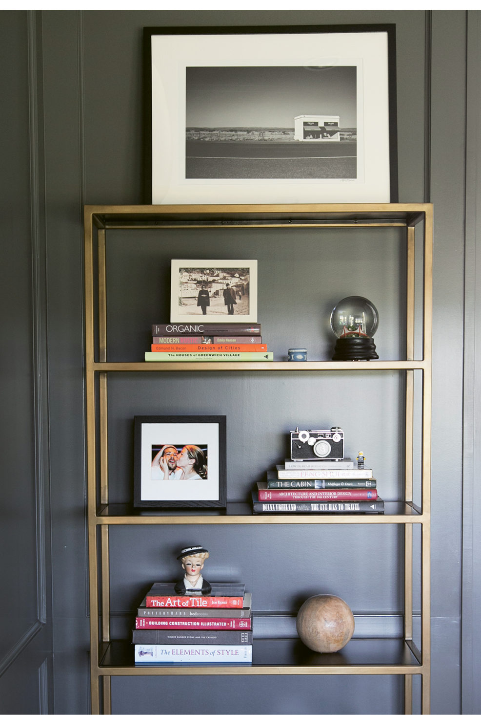 In Melissa’s office, gilded shelves display meaningful mementos, such as vintage cameras and Lego figurines that once belonged to her late brother.