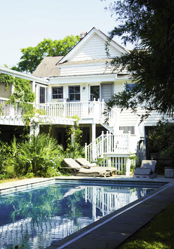 The first-floor living space steps out to the backyard swimming pool