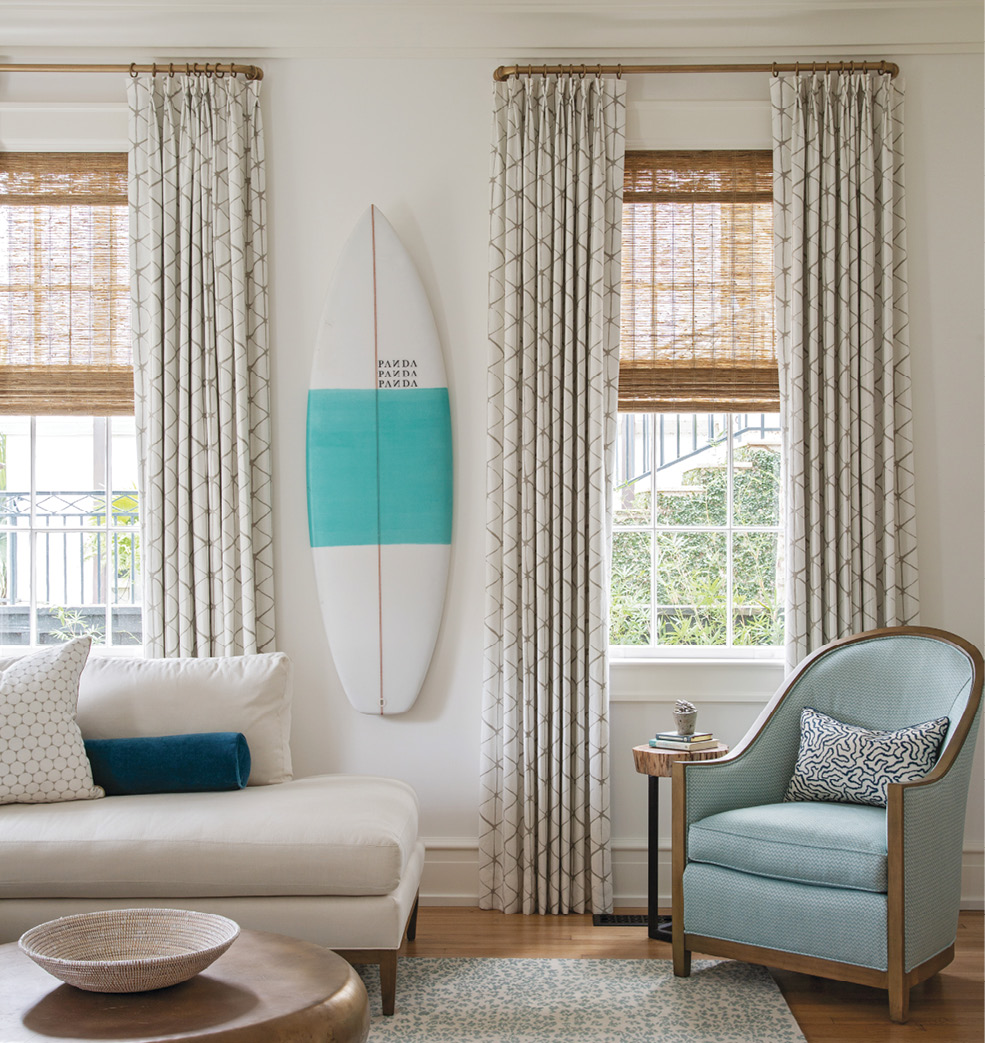 The voluminous drapes, also in Villa Nova fabric, bring warmth and texture to the walls, where a PANDA surfboard nods to Hugh’s passion for the sport.