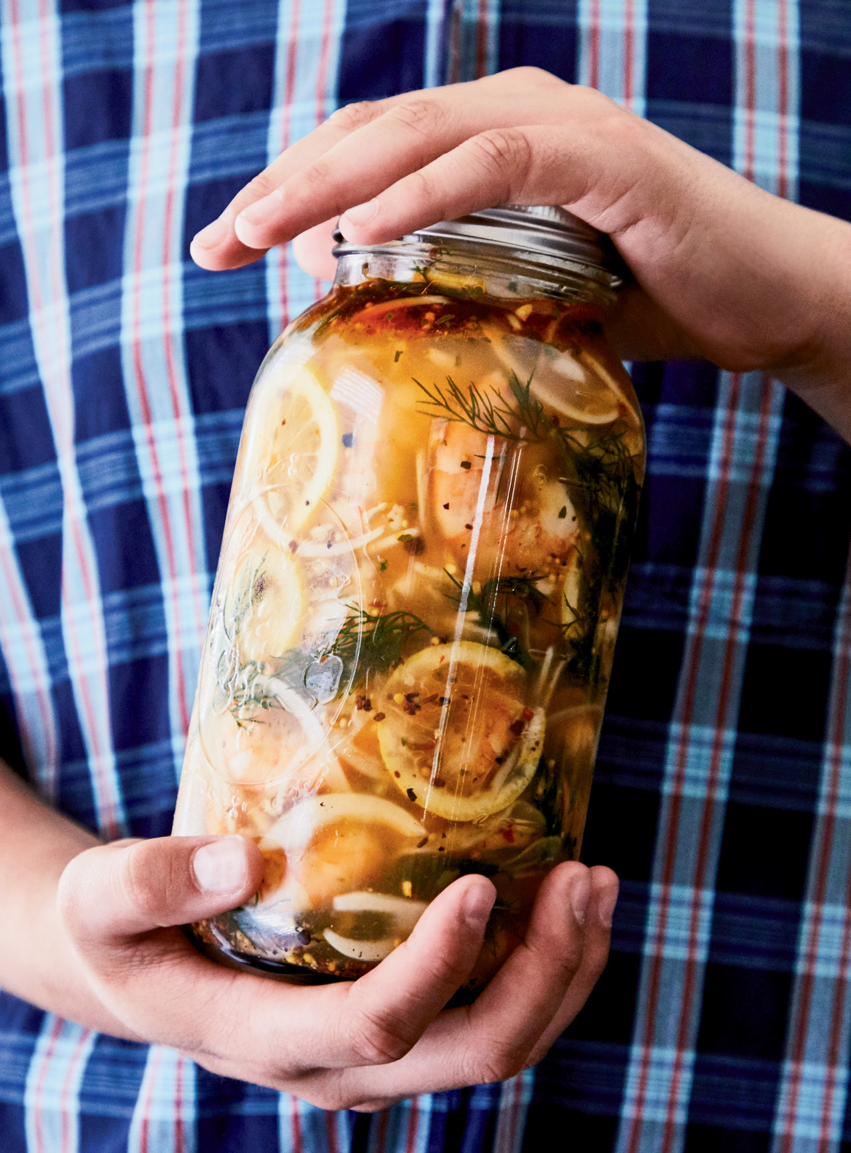 Flavor Medley: DiBernardo pickles local shrimp in a pungent brine along with onions, lemon, and dill. (Opposite) In this fresh salad, grilling gives the corn a sweet boost to balance the jalapeño spice.