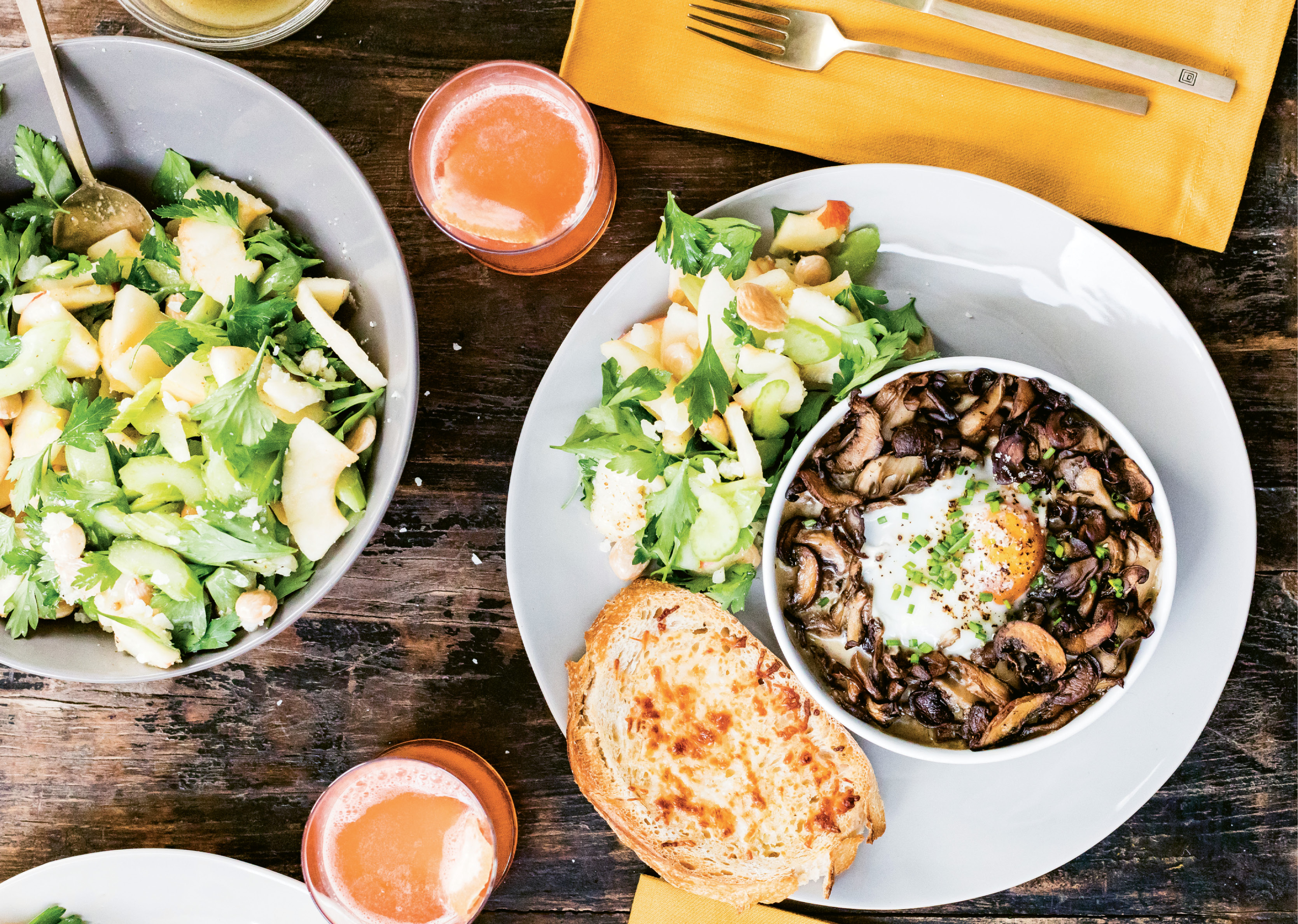 Crusty, cheesy toasts are perfect for dipping into the savory mushroom and egg bake, while a bright apple salad delivers satisfying crunch.
