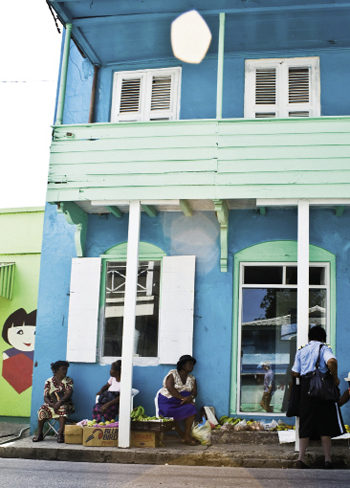 Brightly painted wooden buildings (opposite) line the streets of historic Speightstown to the north, while buzzing Bridgetown, to the south, is the largest city. To drive between the two is to see the gamut of island scenery: urban streets, laid-back beach cafés and bars, trendy boutiques, upscale restaurants, simple inns, and gated resorts.