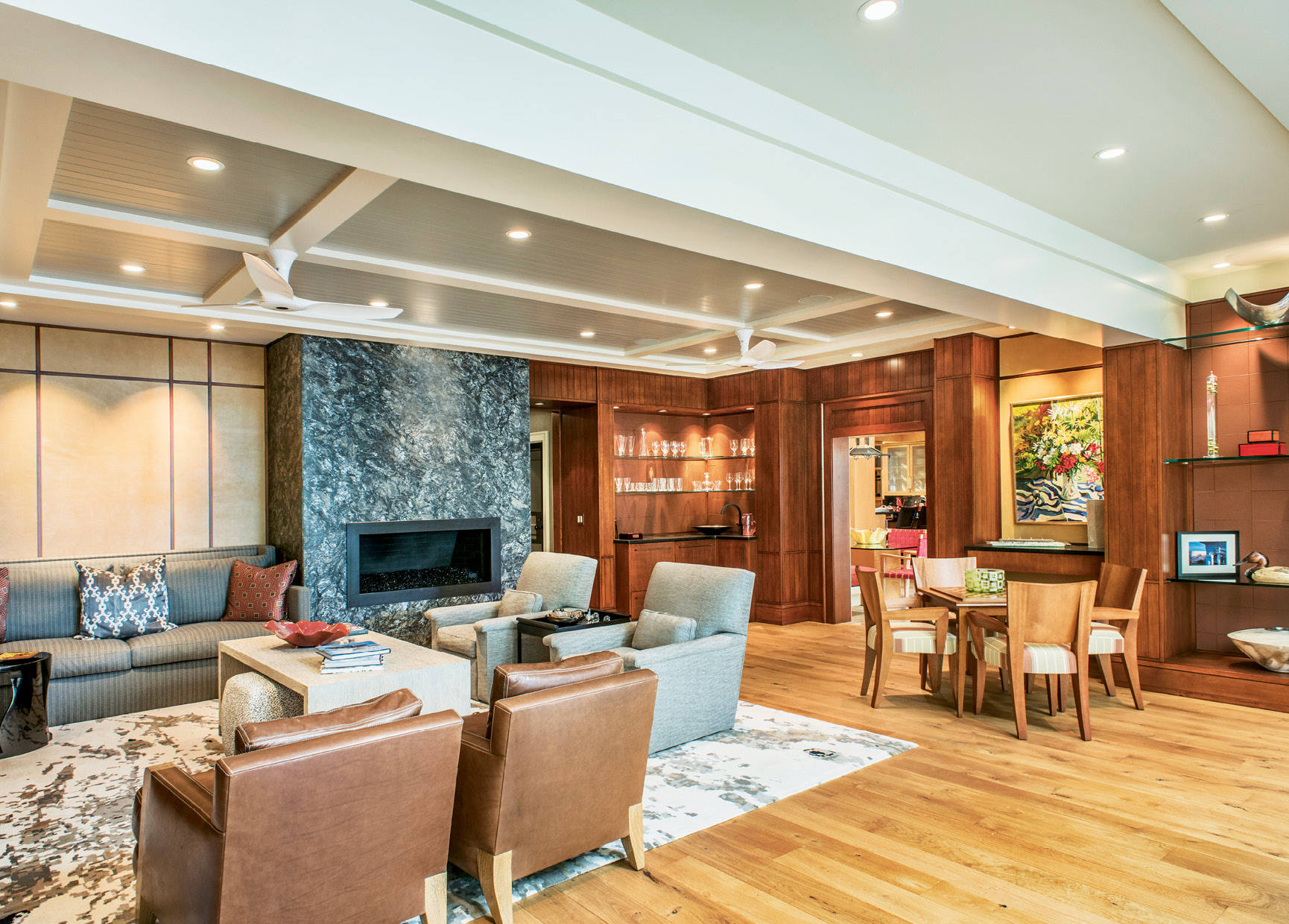 Leather panels add warmth and texture on the walls, and two sitting areas accommodate cozy conversations or big parties.