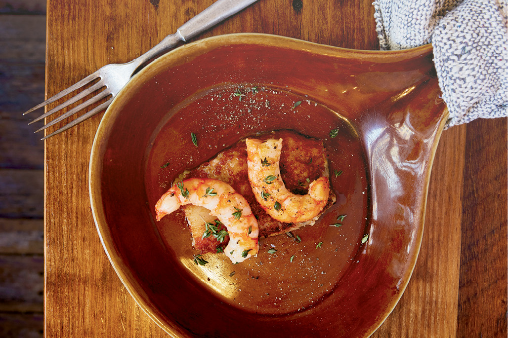 Snacks offered include scrapple, a pork patty topped with local shrimp.