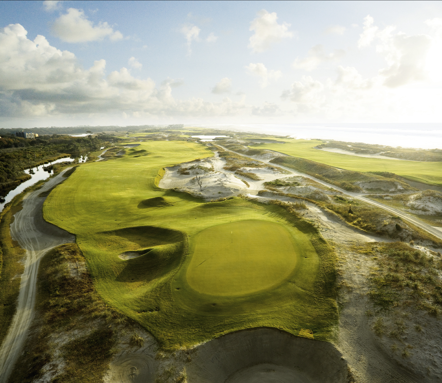 An aerial view of hole 11 illustrates Pete Dye’s wicked mix: a poetic juxtaposition of menacing sand, manicured greens, and wind