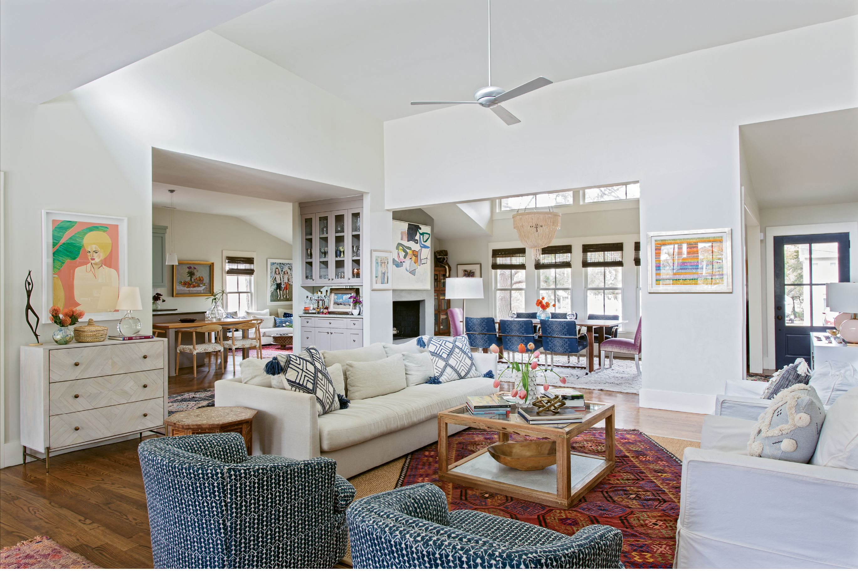 Go WIth The Flow: The smartly redesigned floor plan interconnects cooking, dining, and living spaces, and inset cabinetry helps to make the most of the 2,400 square feet. Close friend and interior designer Jenny Keenan pitched in by assisting with space planning and lighting, as well as selecting paint colors, textiles, and furnishings, many of which are vintage. The swivel chairs, for example, were scored at Indigo Market and reupholstered...