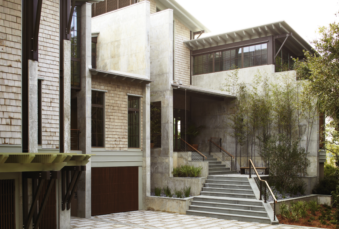 Concrete Ideas: Architect Jim Thomas designed the earthy, modern residence to fit an irregular marshfront peninsula; a series of staggered, parallel concrete walls served as his dominant design principle.