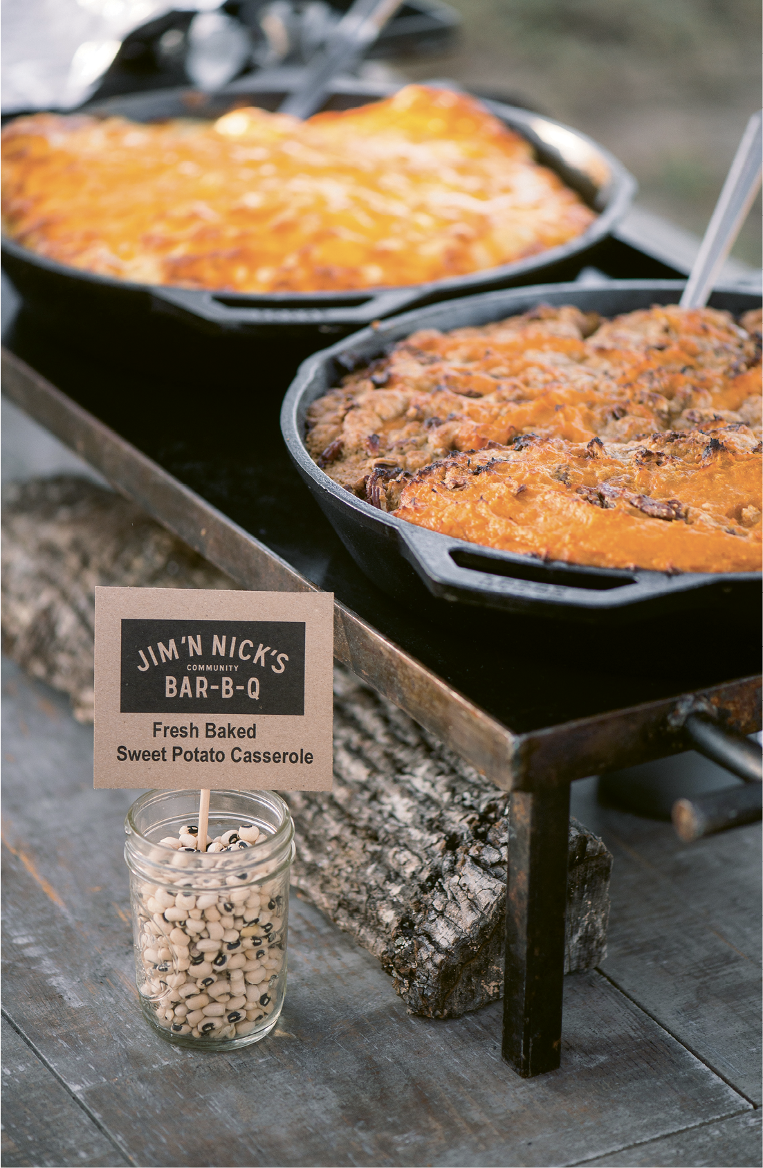 The cast-iron skillets and black-eyed pea menu markers on the buffet table fit right in with the event’s down-home vibe.