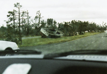 There, 75 percent of the trees had been felled and the storm surge reached all the way to Highway 17, where a boat landed in the median