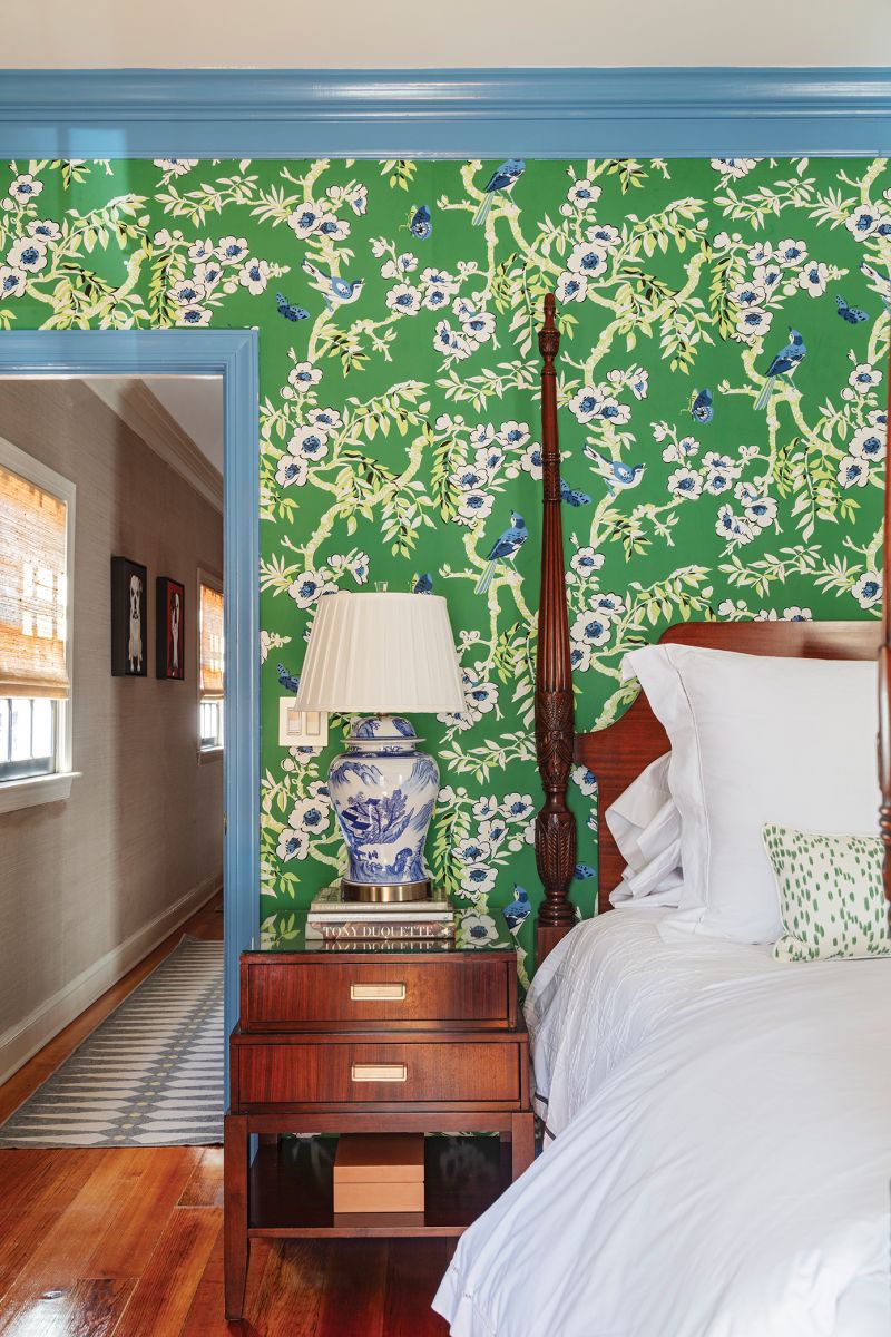 In the guest room, Thibaut “Yukio” wallpaper in green steals the show.