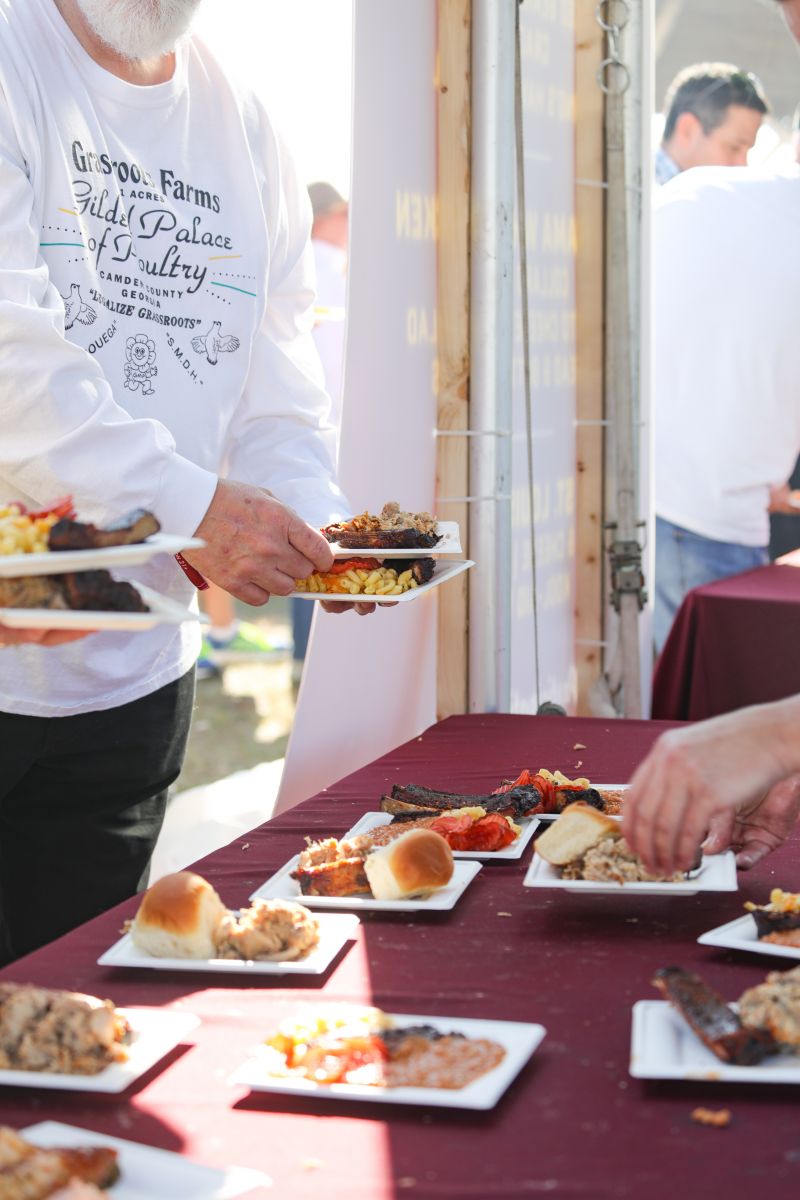 Collaborative plates from the Traditional Village, filled with mac and cheese, Kool-Aid pickles, St. Louis ribs, whole hog barbecue, and more.