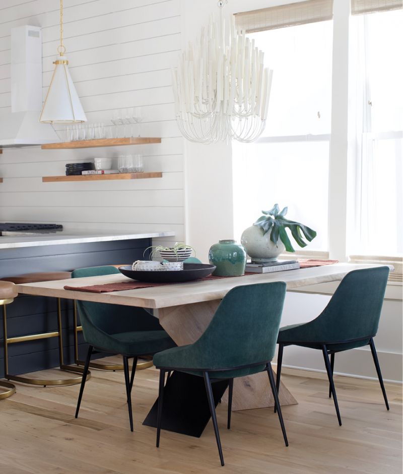 Green velvet chairs by Moes