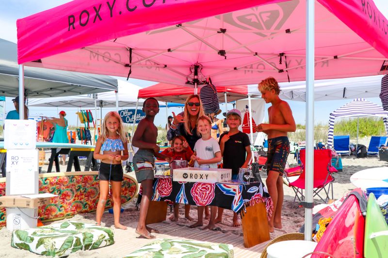 Attendees browsed vendor booths with surf gear and apparel.