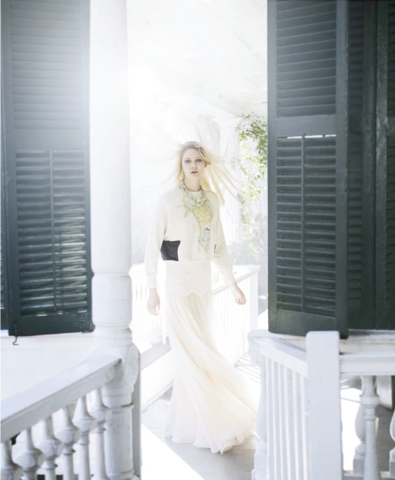 IN LIKE a LION Tadashi Shoji “Paillette” embroidered lace and tulle skirt gown, $648 at tadashishoji.com; Swash London embroidered sweatshirt, $435 at swash.co.uk; Bluma Project geometric wooden necklaces, $48 each at Cynthia Rowley