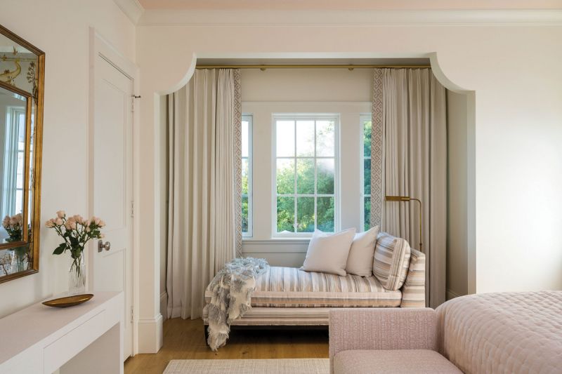 Pattern Play: The upstairs guest rooms are characterized by more floral fabrics and plenty of space to relax, including matching chaise lounge chairs, each covered in Perennials fabrics.