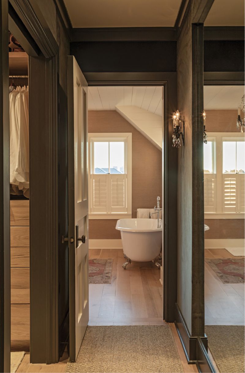 The large walk-in closet features Donghia velvet wallpaper.