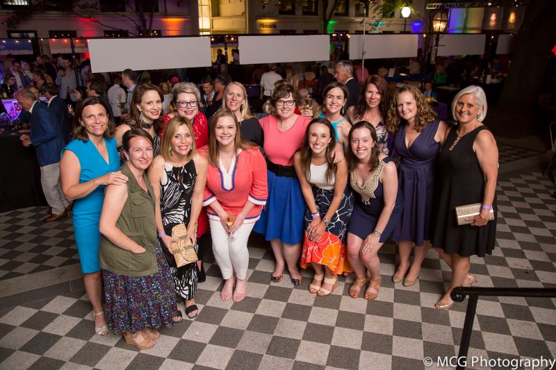 Members of the Gibbes staff gather to celebrate a successful evening.